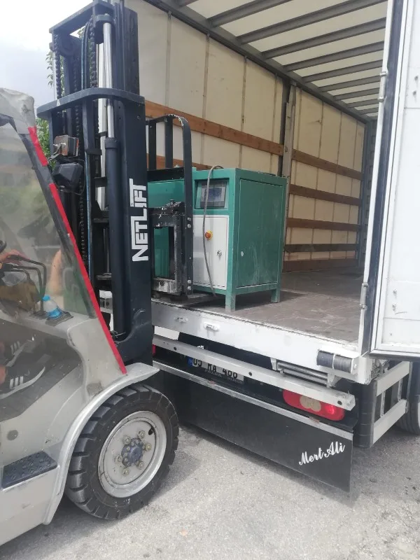 machine loading into export truck