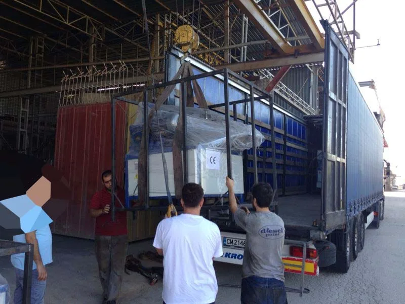 machinery loading into export truck